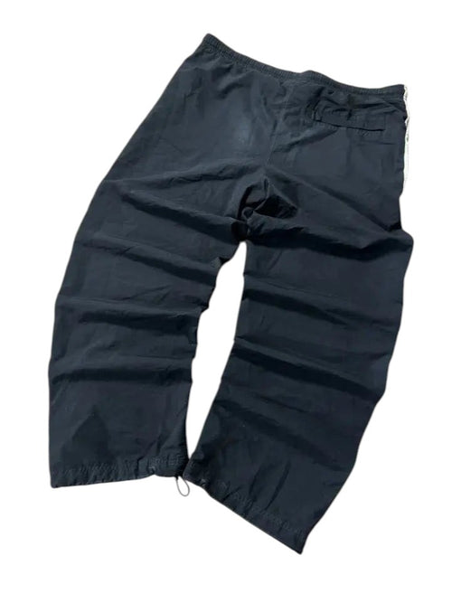 modadeclase Vintage Nike Trackpants in Schwarz mit weißem Seitenstreifen, gerader Schnitt aus Nylon und Polyester