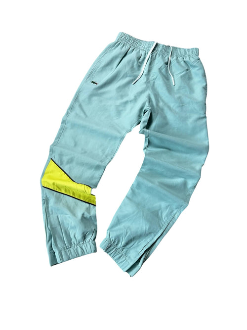 modadeclase Vintage Lacoste Trainingshose in Mintgrün mit gelben Kontrastdetails und gesticktem Logo